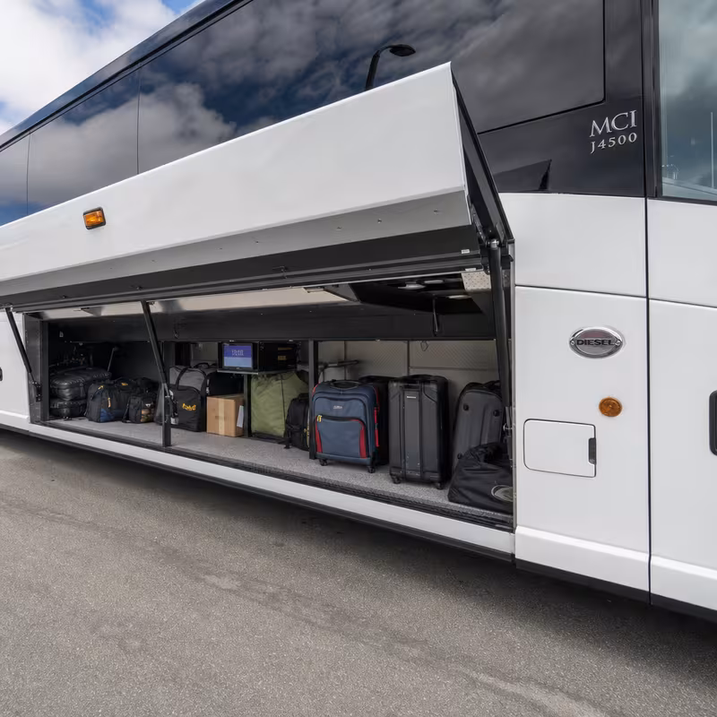 Party bus interior with wraparound leather seating and LED lighting in Princeton
