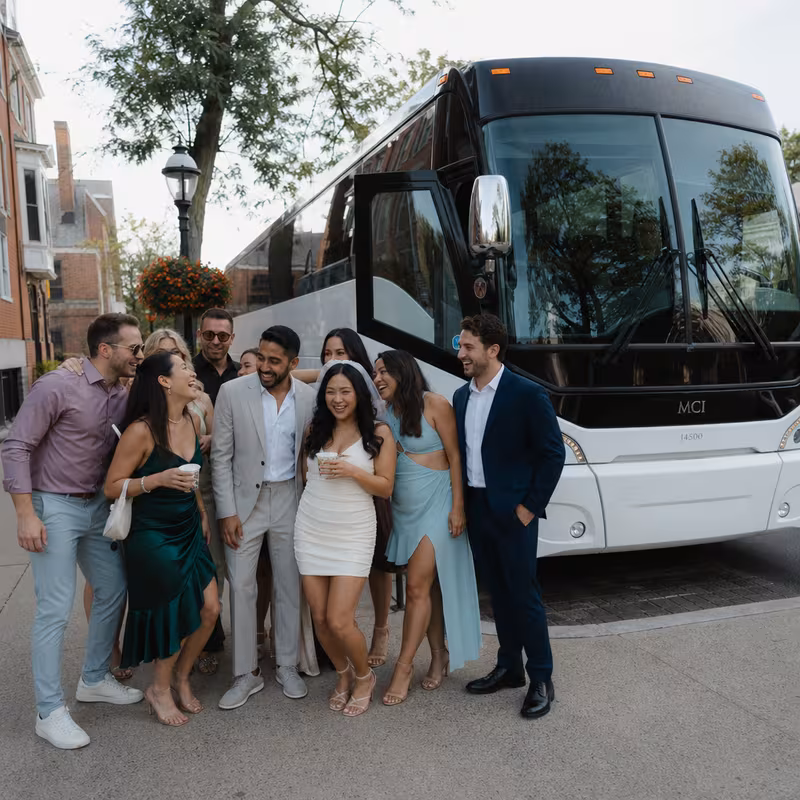 Passengers loading luggage while boarding an Princeton group shuttle