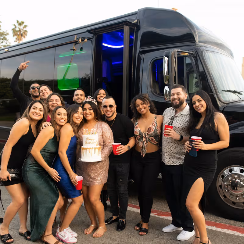 Group boarding a white charter bus for Birthday Transportation transportation in Princeton