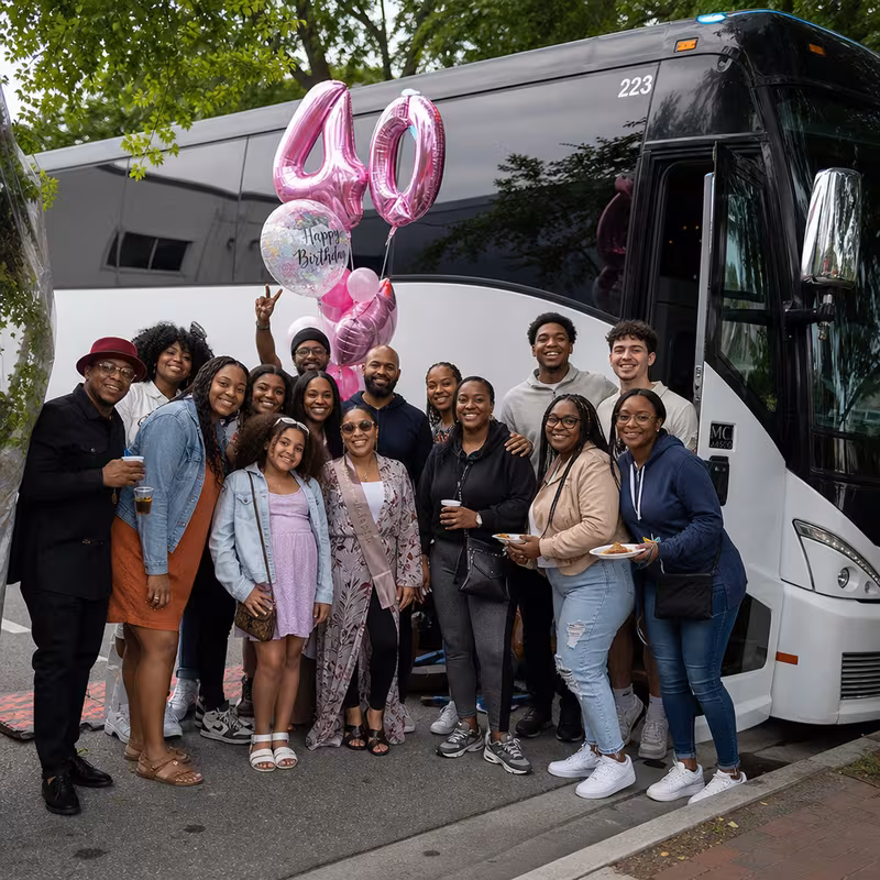 Passengers loading luggage while boarding an Princeton group shuttle