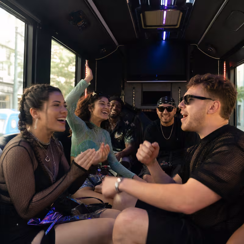Passengers loading luggage while boarding an Princeton group shuttle