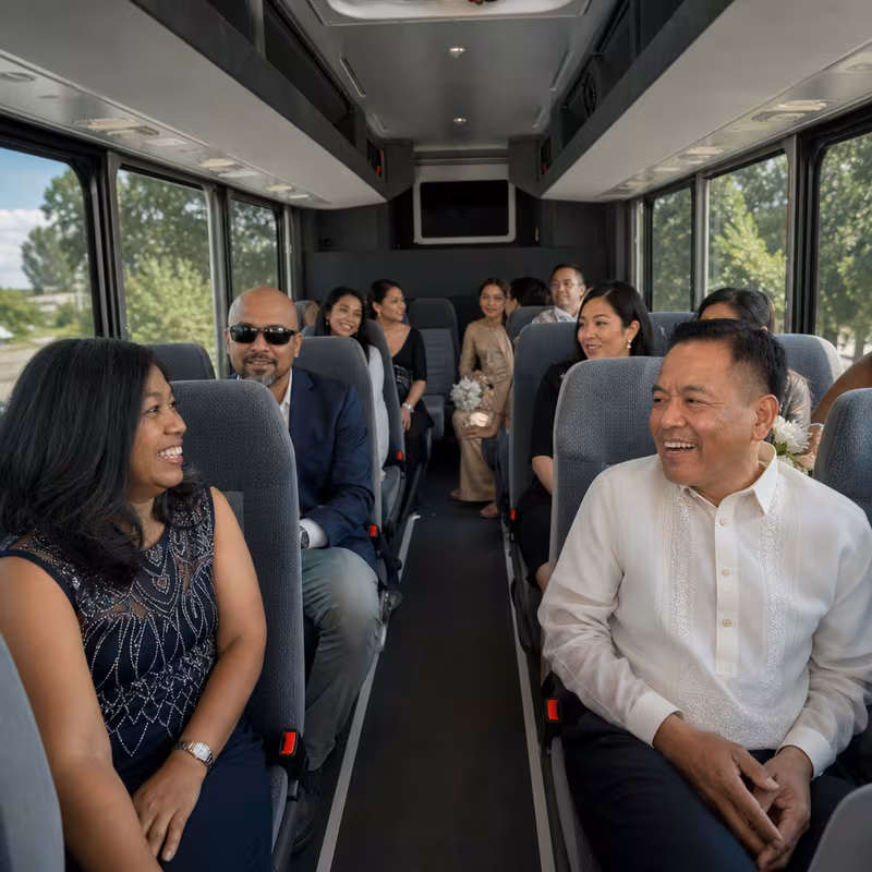 Group boarding a white charter bus for Private Event Transportation transportation in Princeton