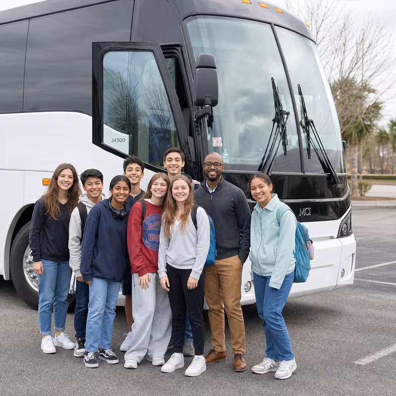 Passengers loading luggage while boarding an Princeton group shuttle