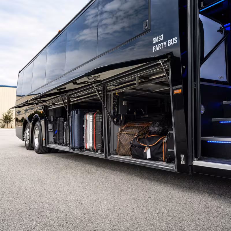 Party bus interior with wraparound leather seating and LED lighting in Princeton