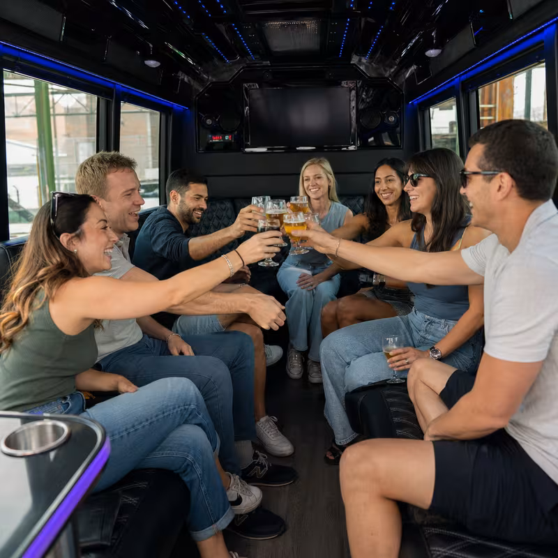 Group boarding a white charter bus for Winery & Brewery Tour Transportation transportation in Princeton