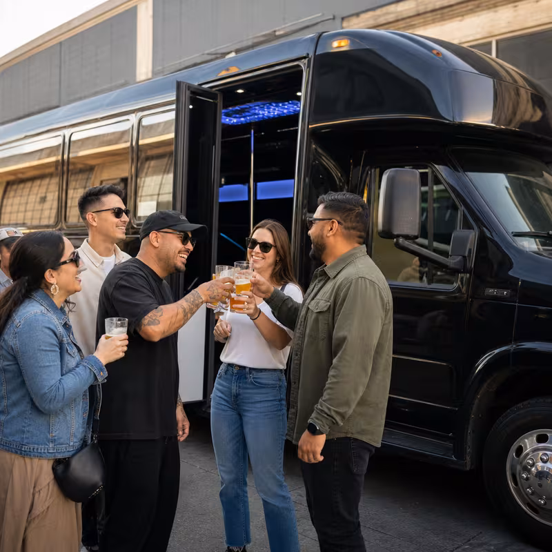 Passengers loading luggage while boarding an Princeton group shuttle